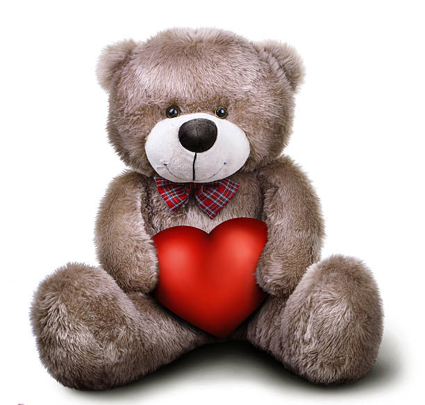 istock Toy soft teddy bear with valentine heart 488007938