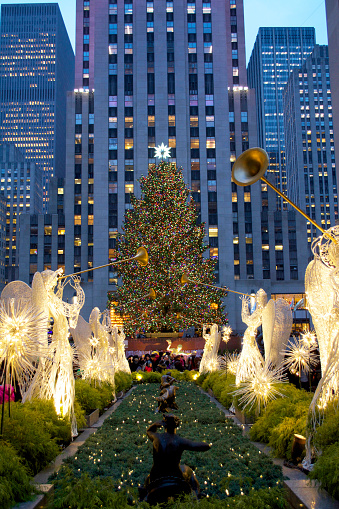 New York City, NY, United States of America, December 8, 2014: Taken from 5th Avenue, a shot of the Rockefeller Center Christmas Tree from 5th Avenue.