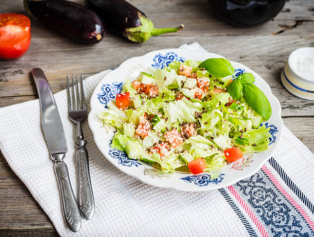 istock Fresh vegetable salad with tomato, eggplant, seeds, clean eating 488010836