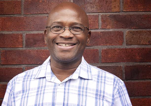 istock happy mature man of african descent 488011602