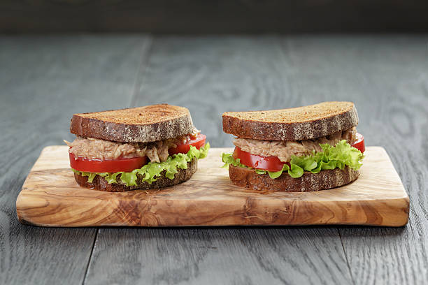 istock sandwich with tuna and vegetables on rye bread 488012186