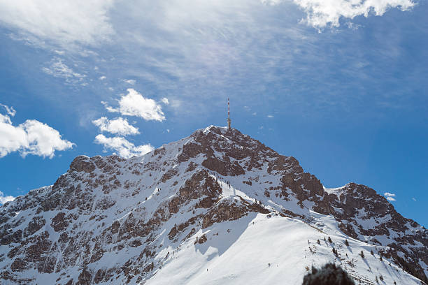 Hikers on snowy mountain ridge, Trebevic, Bosnia and Herzegovina