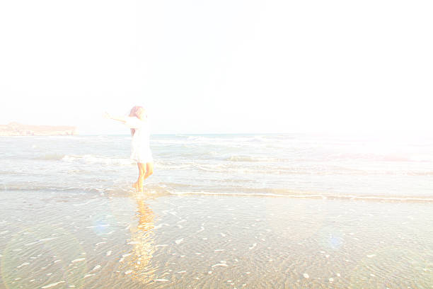 istock Happy Young Woman at beach 488014638