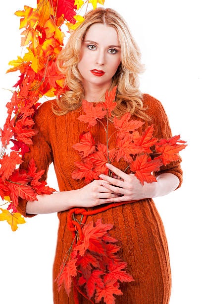 istock Woman with autumn leaves 488014646
