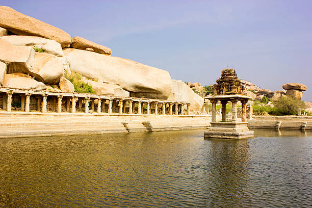 istock Ancient water pool with ruins in Hampi, India 488016066