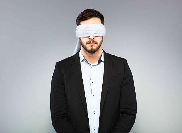 Blindfolded elegant man stock photo