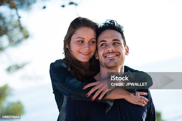 Happy Young Couple On Vacation By The Sea Stock Photo - Download Image Now - 20-29 Years, Adult, Beautiful People