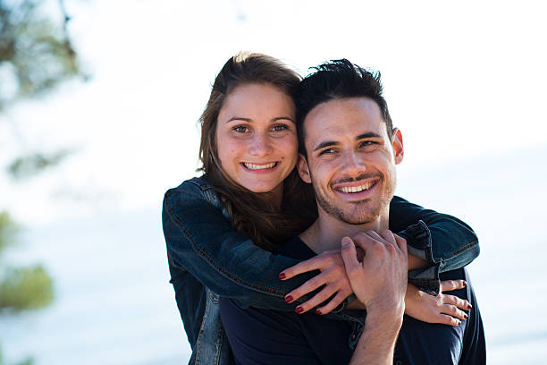 istock happy young couple on vacation by the sea 488029645