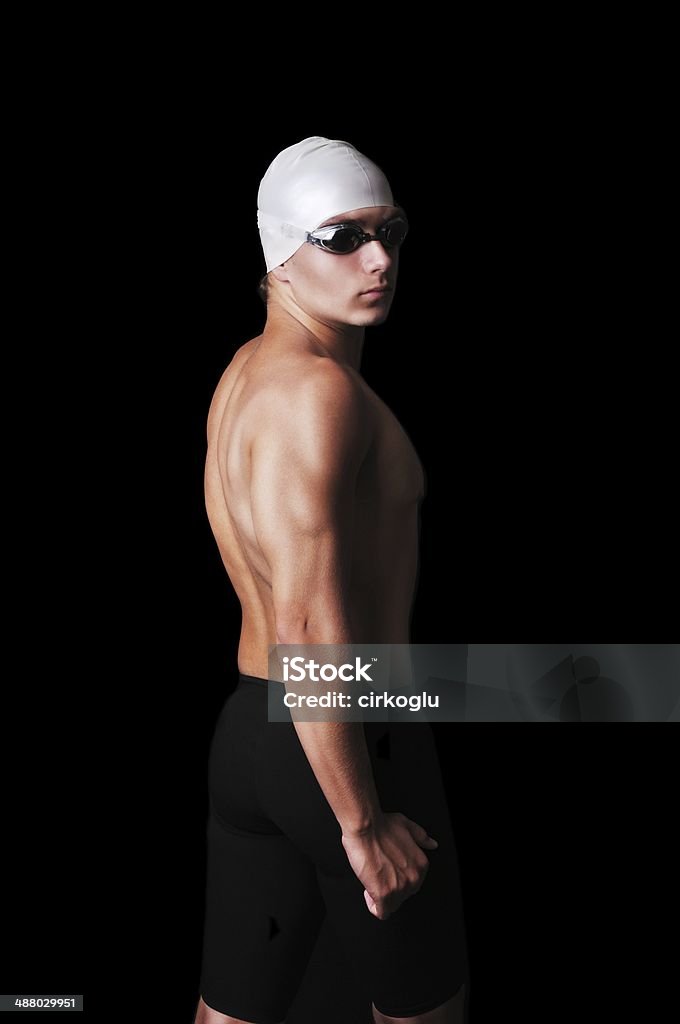 Portrait of muscular male swimmer Male swimmer isolated on black Active Lifestyle Stock Photo