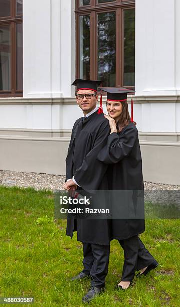 Couple In The Graduation Day Stock Photo - Download Image Now - Achievement, Adult, Adults Only