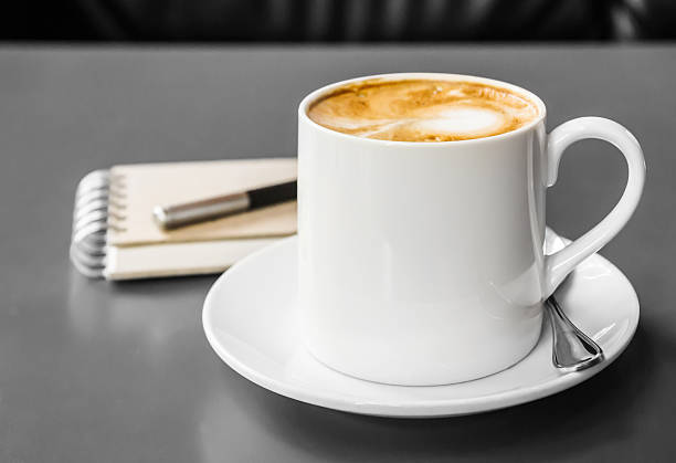 istock Coffee cup and saucer on the table 488030735
