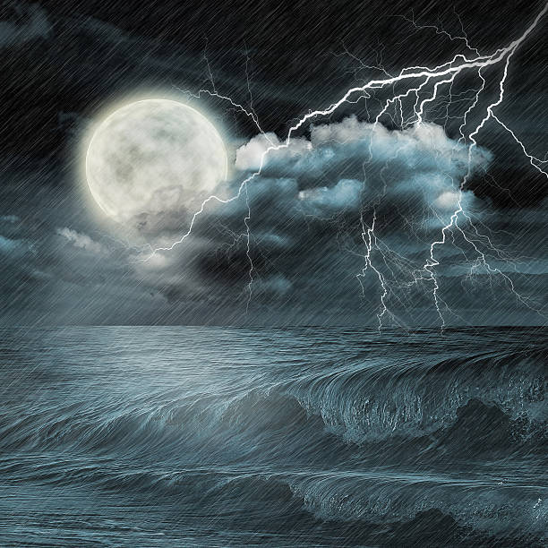 istock storm evening on ocean and the moon 488031107