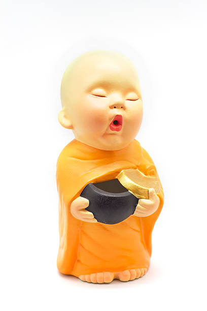 istock Earthenware of child monk isolated on white background 488031255