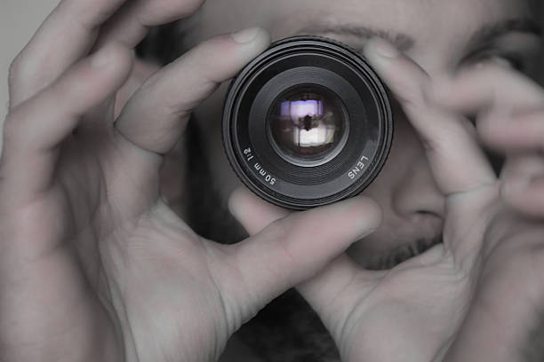 istock Two hands to focus the lens / eye 488032667
