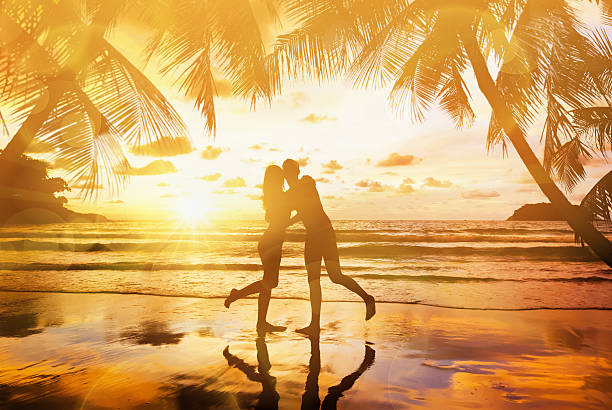 istock Young couple enjoying the sunset 488033515