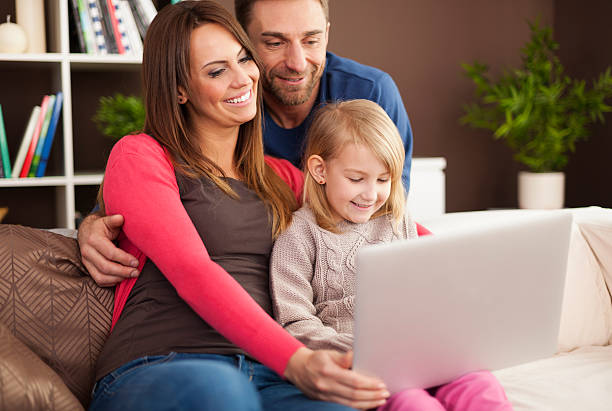 istock Happy family enjoying of modern technology 488046483