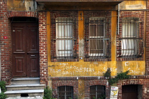 Istanbul, Turkey - December 5, 2013: Facade of old abandoned houses from balat district of istanbul,Turkey.