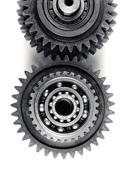cog wheels and ball bearings on isolated background
