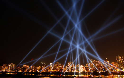 Vancouver, Canada - February, 5th 2010: Beams of light over the False Creek skyline from the artwork Vectorial Elevation by Rafael Lozano-Hemmer.