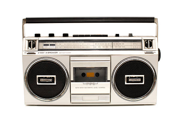 Portable, Silver Boom Box, With White Background Color image of a silver, personal stereo, with radio and tape player/recorder. On white background. vintage portable silver radio stock pictures, royalty-free photos & images