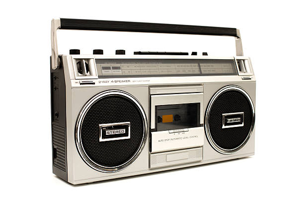 Portable, Silver Boom Box, With White Background Color image of a silver, personal stereo, with radio and tape player/recorder. On white background. vintage portable silver radio stock pictures, royalty-free photos & images
