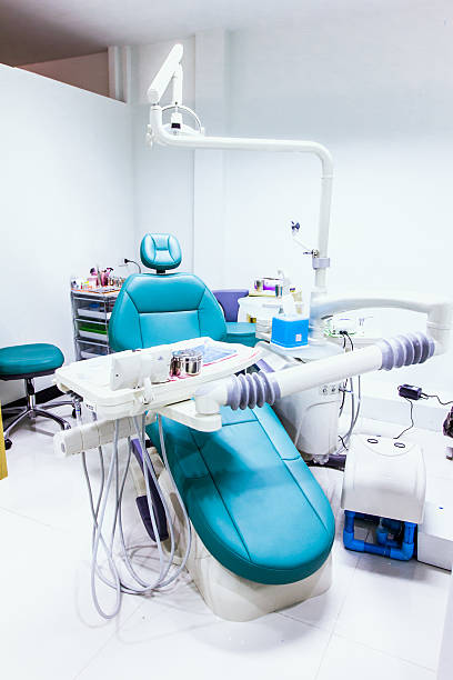 istock dental clinic interior with chair and tools 488050339
