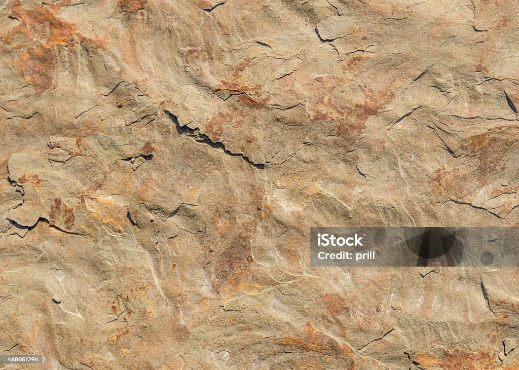 rough stone surface red brown rough stone surface detail Bedrock Stock Photo