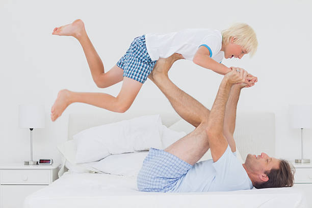 istock Father holding his son in the air 488052437
