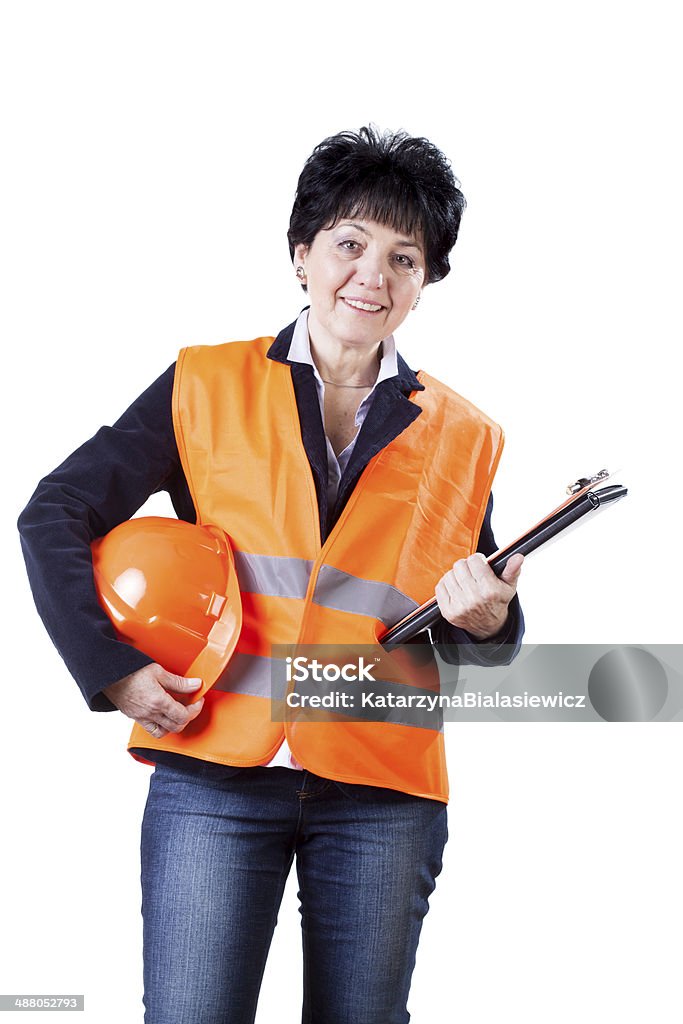 Happy female building manager A happy smiling female building manager with a helmet and a file Helmet Stock Photo