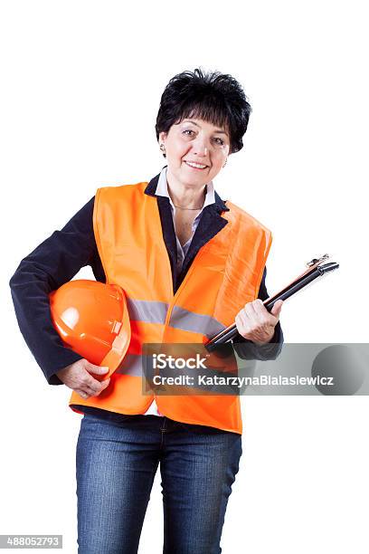 Happy Female Building Manager Stock Photo - Download Image Now - Helmet, Waistcoat, Women