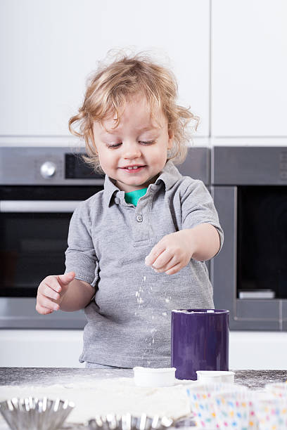 istock Little boy preparing food 488053287