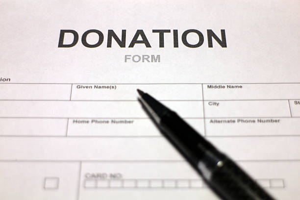 istock Someone filling out Donation Form 488053650