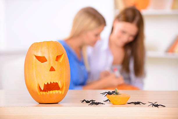 istock Pretty girls preparing for Halloween party 488055162