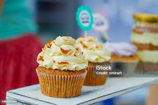 Cupcakes With Cream And Berries Stock Photo - Download Image Now - 2015, Backgrounds, Baked