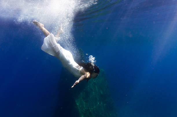 istock beautiful girl underwater 488058136