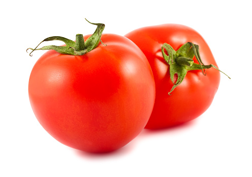 Two red tomatoes isolated over white background