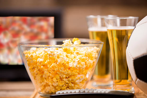 istock Soccer game on television at pub or home. Popcorn. Ball. 488061604