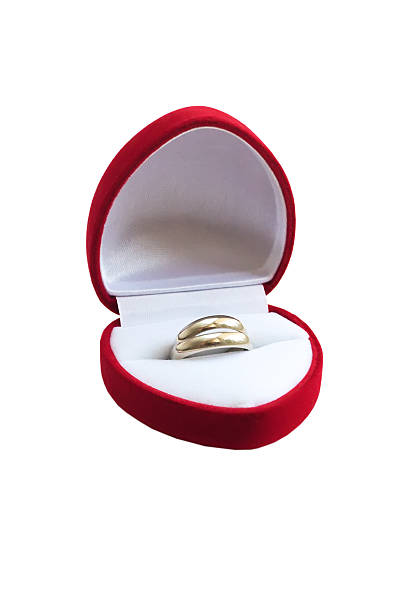 istock Gold wedding rings in a red box on white background 488062218