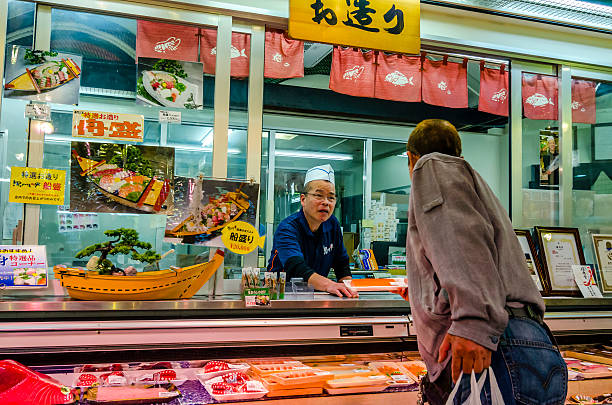 Osaka, Japan - April 18, 2014: Fresh seafood shop in Kuromon Ichiba market.The market has been called \
