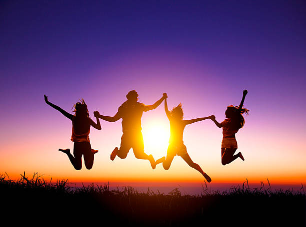 istock group of happy young people jumping on the mountain 488063892
