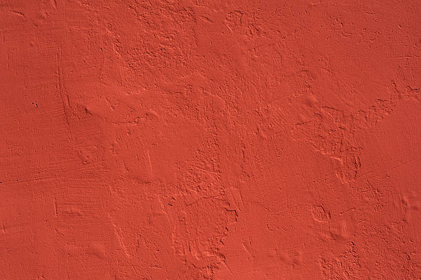 istock Texture of old wall covered with red stucco 488064280
