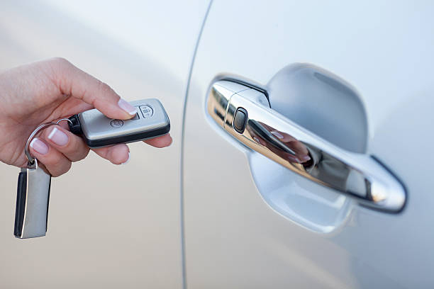 istock Pretty young woman is ready to sit in car 488064374