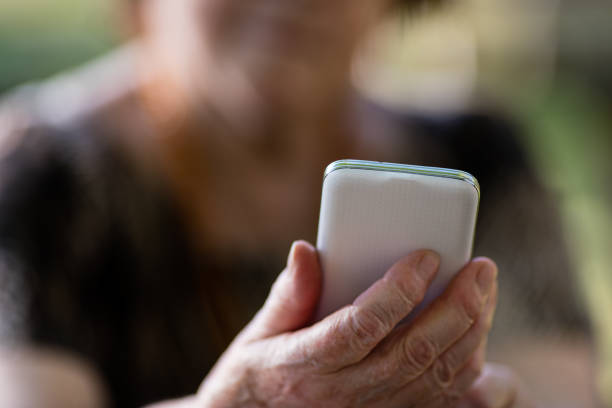 istock old woman with a smartphone 488065910