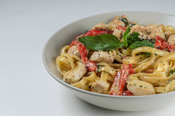 istock Bowl of pasta served with fresh basil 488065912