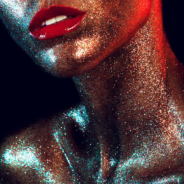 Beautyful girl with gold glitter on her face Beautyful girl with gold glitter on her face and red lips haute couture stock pictures, royalty-free photos & images