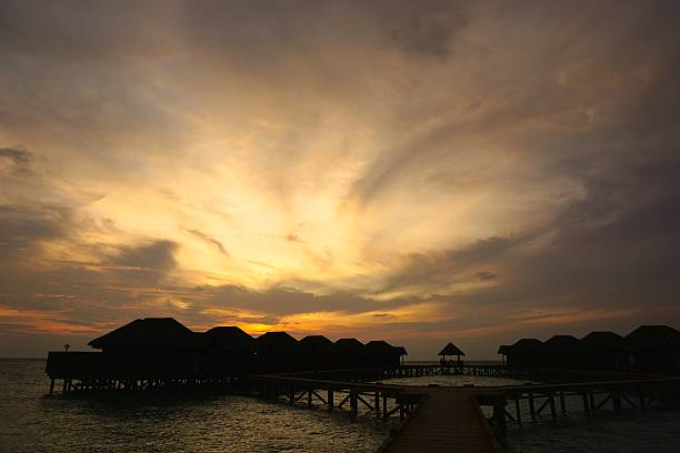 istock silhouette of water villa 488076055