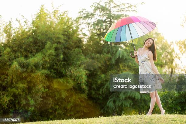 Woman With White Umbrella Standing In Field Stock Photo - Download Image Now - Admiration, Adult, Adults Only