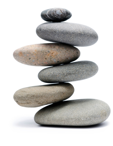 Balancing of pebbles isolated on white background with clipping path