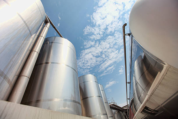 Silver silos and tank - industrial infrastructure stock photo
