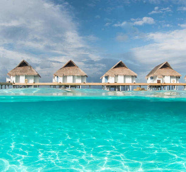istock Maldivian water bungalows ,half water photography 488077925